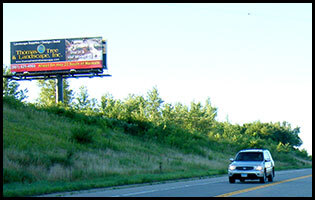 Supreme Outdoor billboard on highway overpass